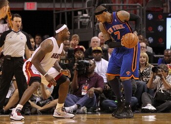 MIAMI, FL - FEBRUARY 27:  Carmelo Anthony #7 of the New York Knicks is guarded by LeBron James #6 of the Miami Heat during a game at American Airlines Arena on February 27, 2011 in Miami, Florida. NOTE TO USER: User expressly acknowledges and agrees that,