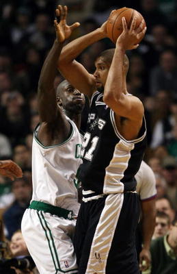 BOSTON - FEBRUARY 08:   Kevin Garnett #5 of the Boston Celtics puts the pressure on Tim Duncan #21 of the San Antonio Spurs on February 8, 2009 at TD Banknorth Garden in Boston, Massachusetts. The Spurs defeated the Celtics 105-99. NOTE TO USER: User expr