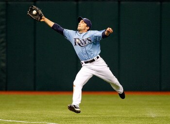 ST. PETERSBURG, FL - APRIL 03:  Outfielder Sam Fuld #5 of the Tampa Bay Rays catches a ball against the Baltimore Orioles during the game at Tropicana Field on April 3, 2011 in St. Petersburg, Florida.  (Photo by J. Meric/Getty Images)