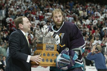 EAST RUTHERFORD, NJ - JUNE 9:  Goalie Jean-Sebastien Giguere #35 of the Mighty Ducks of Anaheim receives the playoff Conn-Smyth MVP trophy after being defeated by the Devils 3-0 in game seven of the 2003 Stanley Cup Finals at Continental Airlines Arena on