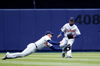 NEW YORK, NY - MARCH 31:  Austin Jackson #14 of the Detroit Tigers looks on as Ryan Raburn #25 catches a ball hit by Russell Martin #55 (not pictured) of the New York Yankees in the fifth inning of Opening Day at Yankee Stadium on March 31, 2011 in the Br