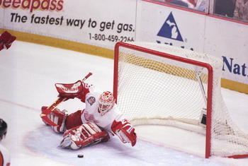 7 Jun 1997:  Goaltender Mike Vernon of the Detroit Red Wings blocks a shot during a playoff game against the Philadelphia Flyers at Joe Louis Arena in Detroit, Michigan.  The Red Wings won the game, 2-1. Mandatory Credit: Al Bello  /Allsport