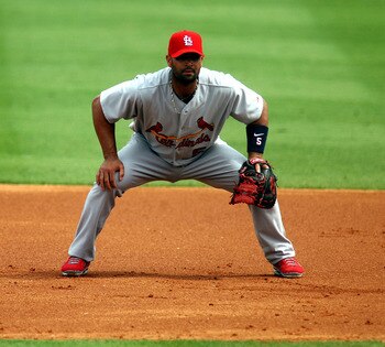 JUPITER, FL - MARCH 06:  First baseman Albert Pujols #5 of the St. Louis Cardinals plays against the Florida Marlins at Roger Dean Stadium on March 6, 2011 in Jupiter, Florida.  (Photo by Marc Serota/Getty Images)