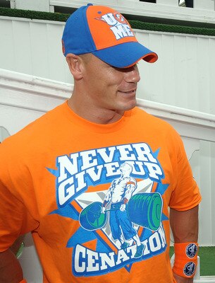 LONG POND, PA - JUNE 06:  WWE champion and co-grand marshal John Cena (L) and Denny Hamlin, driver of the #11 FedEx Freight Toyota, talk in Victory Lane prior to the NASCAR Sprint Cup Series Gillette Fusion ProGlide 500 at Pocono Raceway on June 6, 2010 i