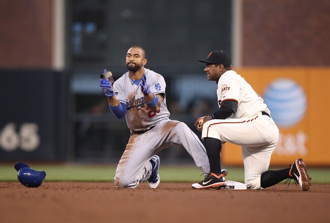 SAN FRANCISCO, CA - APRIL 11:  Matt Kemp #27 of the Los Angeles Dodgers celebrates after stealing second base past Miguel Tejada #10 of the San Francisco Giants in the second inning during an MLB game at AT&T Park on April 11, 2011 in San Francisco, Calif