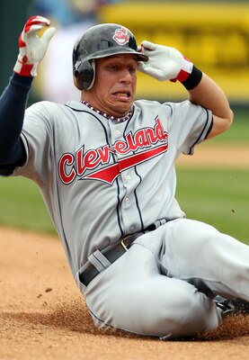 KANSAS CITY, MO - MAY 13:  Shortstop Asdrubal Cabrera #13 of the Cleveland Indians slides into third for a triple during the 1st inning of the game against the Kansas City Royals on May 13, 2010 at Kauffman Stadium in Kansas City, Missouri.  (Photo by Jam