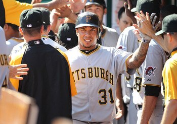 CINCINNATI - SEPTEMBER 12:  Jose Tabata #31 of the Pittsburgh Pirates is congratulated by teammates after scoring one of the three ninth inning runs during the game against the Cincinnati Reds at Great American Ballpark on September 12, 2010 in Cincinnati