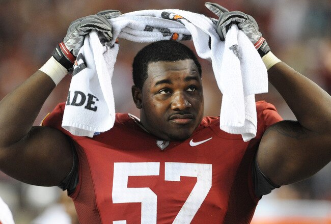 TUSCALOOSA, AL - NOVEMBER 13: Defensive lineman Marcell Dareus #57 of the Alabama Crimson Tide watches play against the Mississippi State Bulldogs November 13, 2010 at Bryant-Denny Stadium in Tuscaloosa, Alabama.  (Photo by Al Messerschmidt/Getty Images)