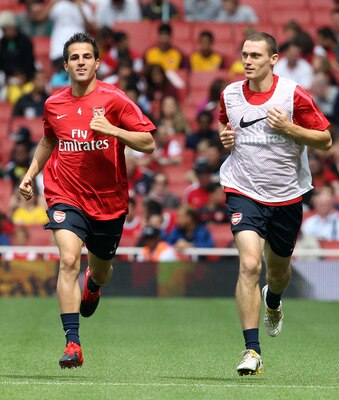 LONDON, ENGLAND - AUGUST 05:  Cesc Fabregas and Thomas Vermaelen attend an Arsenal open training session at Emirates Stadium on August 5, 2010 in London, England.  (Photo by Bryn Lennon/Getty Images)
