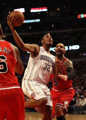 CHICAGO, IL - FEBRUARY 15: Boris Diaw #32 of the Charlotte Bobcats moves to the basket past Carlos Boozer #5 of the Chicago Bulls at the United Center on February 15, 2011 in Chicago, Illinois. NOTE TO USER: User expressly acknowledges and agrees that, by