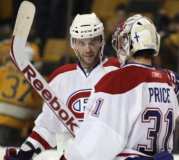 BOSTON, MA - APRIL 14:  Benoit Pouliot #57 of the Montreal Canadiens congratulates Carey Price #31 after Price shut out the Boston Bruins  in Game One of the Eastern Conference Quarterfinals during the 2011 NHL Stanley Cup Playoffs at TD Garden on April 1