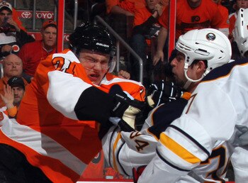 PHILADELPHIA, PA - APRIL 14: James van Riemsdyk #21 of the Philadelphia Flyers hits Chris Butler #34 of the Buffalo Sabres in Game One of the Eastern Conference Quarterfinals during the 2011 NHL Stanley Cup Playoffs at Wells Fargo Center on April 14, 2011