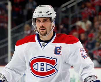 NEWARK, NJ - APRIL 02:  Brian Gionta #21 of the Montreal Canadians waits for a faceoff during an NHL hockey game against the New Jersey Devils at the Prudential Center on April 2, 2011 in Newark, New Jersey.  (Photo by Paul Bereswill/Getty Images)