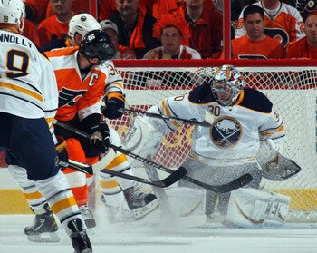 PHILADELPHIA, PA - APRIL 14: Mike Richards #18 of the Philadelphia Flyers watches his shot hit the pads of Ryan Miller #30 of the Buffalo Sabres in Game One of the Eastern Conference Quarterfinals during the 2011 NHL Stanley Cup Playoffs at Wells Fargo Ce