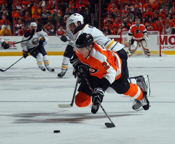 PHILADELPHIA, PA - APRIL 14: Steve Montador #4 of the Buffalo Sabres takes a two minute penalty for tripping James van Riemsdyk #21 of the Philadelphia Flyers in Game One of the Eastern Conference Quarterfinals during the 2011 NHL Stanley Cup Playoffs at