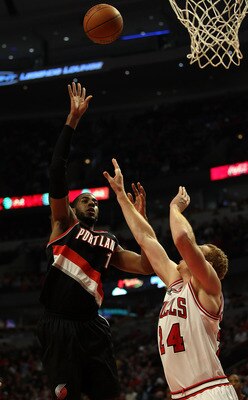 CHICAGO - NOVEMBER 01: LaMarcus Aldridge #12 of the Portland Trail Blazers puts up a shot over Brian Scalabrine #24 of the Chicago Bulls at the United Center on November 1, 2010 in Chicago, Illinois. The Bulls defeated the Trail Blazers 110-98. NOTE TO US