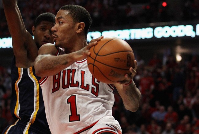 CHICAGO, IL - APRIL 16: Derrick Rose #1 of the Chicago Bulls leaps to pass the ball around Paul George #24 of the Indiana Pacers in Game One of the Eastern Conference Quarterfinals in the 2011 NBA Playoffs at the United Center on April 16, 2011 in Chicago