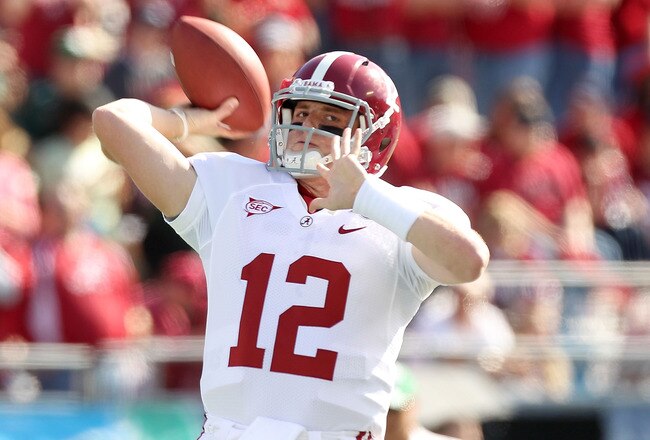 ORLANDO, FL - JANUARY 01:  Greg McElroy #12 of the Alabama Crimson Tide warms up during the Capitol One Bowl against the Michigan State Spartans at the Florida Citrus Bowl on January 1, 2011 in Orlando, Florida.  (Photo by Mike Ehrmann/Getty Images)