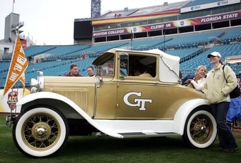 JACKSONVILLE, FL - DECEMBER 02:  Georgia Tech Yellow Jackets fans drive onto the field in an antique car prior to a game against the Wake Forest Demon Deacons during the Atlantic Coast Conference Championship on December 2, 2006 at Alltel Stadium in Jacks