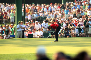 AUGUSTA, GA - APRIL 10:  Tiger Woods reacts to a missed eagle putt on the 15th hole during the final round of the 2011 Masters Tournament at Augusta National Golf Club on April 10, 2011 in Augusta, Georgia.  (Photo by Andrew Redington/Getty Images)