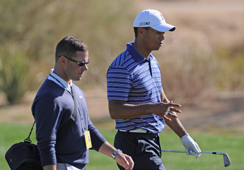 MARANA, AZ - FEBRUARY 22:  Tiger Woods talks with coach Sean Foley during practice prior to the start of the World Golf Championships-Accenture Match Play Championship held at The Ritz-Carlton Golf Club, Dove Mountain on February 22, 2011 in Marana, Arizo