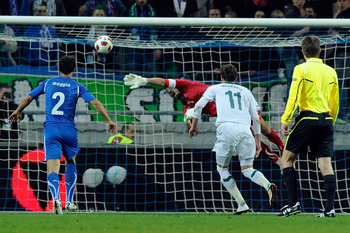 LJUBLJANA, SLOVENIA - MARCH 25:  Goalkeeper Gianluigi Buffon of Italy dives for the ball during the UEFA EURO 2012 qualifier between Slovenia and Italy on March 25, 2011 in Ljubljana, Slovenia.  (Photo by Claudio Villa/Getty Images)