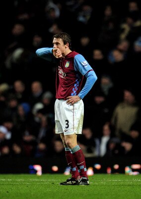 BIRMINGHAM, ENGLAND - DECEMBER 26:  Stephen Warnock of Aston Villa looks on dejected as Villa concede a second goal during the Barclays Premier League match between Aston Villa and Tottenham Hotspur at Villa Park on December 26, 2010 in Birmingham, Englan