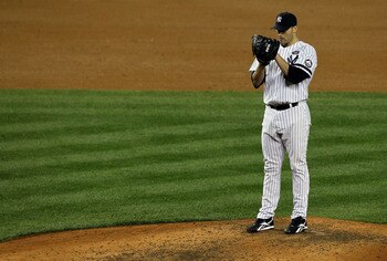 NEW YORK - OCTOBER 18:  Starting pitcher Andy Pettitte #46 of the New York Yankees gets set to throw a pitch against the Texas Rangers in Game Three of the ALCS during the 2010 MLB Playoffs at Yankee Stadium on October 18, 2010 in New York, New York.  (Ph