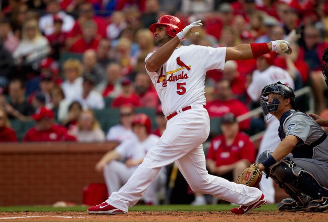 ST. LOUIS, MO - APRIL 2: Albert Pujols #5 of the St. Louis Cardinals hits a solo home run against the San Diego Padres at Busch Stadium on April 2, 2011 in St. Louis, Missouri.  (Photo by Dilip Vishwanat/Getty Images)