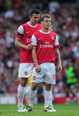 LONDON, ENGLAND - APRIL 17:  Robin van Persie of Arsenal gives advice to team mate Jack Wilshere during the Barclays Premier League match between Arsenal and Liverpool at the Emirates Stadium on April 17, 2011 in London, England.  (Photo by Shaun Botteril