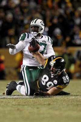 PITTSBURGH, PA - JANUARY 23:  Matt Spaeth #89 of the Pittsburgh Steelers holds up the ball after he made a reception against Bart Scott #57 of the New York Jets during the 2011 AFC Championship game at Heinz Field on January 23, 2011 in Pittsburgh, Pennsy