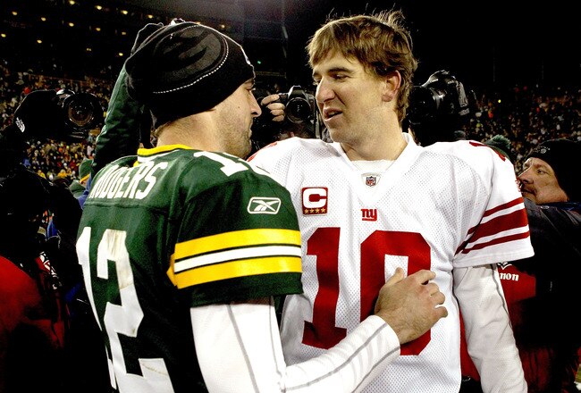 GREEN BAY, WI - DECEMBER 26:  Aaron Rodgers #12 of the Green Bay Packers is congratulated by Eli Manning #10 of the New York Giants after their game at Lambeau Field on December 26, 2010 in Green Bay, Wisconsin.  (Photo by Matthew Stockman/Getty Images)