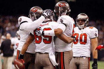 NEW ORLEANS, LA - JANUARY 02:  Quarterback Josh Freeman #5 celebrates after throwing a touchdown  with Dezmon Briscoe #89 of the Tampa Bay Buccaneers during the game against the New Orleans Saints at the Louisiana Superdome on January 2, 2011 in New Orlea