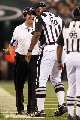 EAST RUTHERFORD, NJ - SEPTEMBER 13:  Head coach John Harbaugh of the Baltimore Ravens stands on the field during their game against the New York Jets at the New Meadowlands Stadium on September 13, 2010 in East Rutherford, New Jersey.  (Photo by Jim McIsa