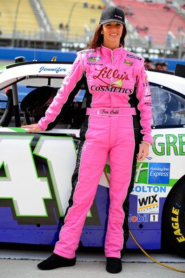 Jennuifer Jo Cobb stands in front of her current Nationwide ride.