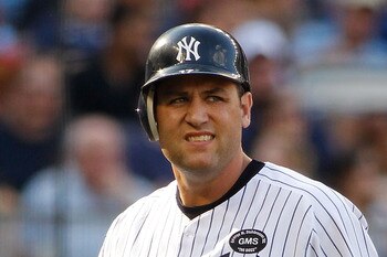 NEW YORK - AUGUST 07:  Lance Berkman #17 of the New York Yankees walks back to the bench after striking out against the Boston Red Sox on August 7, 2010 at Yankee Stadium in the Bronx borough of New York City.  (Photo by Mike Stobe/Getty Images)