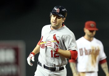 PHOENIX, AZ - APRIL 12:  Lance Berkman #12 of the St. Louis Cardinals rounds the bases after hitting a solo home run against the Arizona Diamondbacks during the second inning of the Major League Baseball game at Chase Field on April 12, 2011 in Phoenix, A