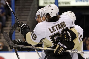 TAMPA, FL - APRIL 20: Tyler Kennedy #48 of the Pittsburgh Penguins celebrates a goal with teammates against the Tampa Bay Lightning in Game Four of the Eastern Conference Quarterfinals during the 2011 NHL Stanley Cup Playoffs at the St. Pete Times Forum o
