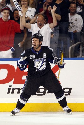 TAMPA, FL - APRIL 20: Martin St. Louis #26 of the Tampa Bay Lightning celebrates a goal against the Pittsburgh Penguins in Game Four of the Eastern Conference Quarterfinals during the 2011 NHL Stanley Cup Playoffs at the St. Pete Times Forum on April 20,