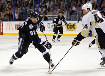 TAMPA, FL - APRIL 20: Steven Stamkos #91 of the Tampa Bay Lightning shoots the puck against Brooks Orpik #44 of the Pittsburgh Penguins in Game Four of the Eastern Conference Quarterfinals during the 2011 NHL Stanley Cup Playoffs at the St. Pete Times For