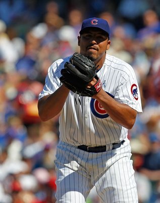 CHICAGO - JUNE 20: Carlos Zambrano #38 of the Chicago Cubs looks at a runner from the Los Angeles Angels of Anaheim at third base before pitching at Wrigley Field on June 20, 2010 in Chicago, Illinois. The Cubs defeated the Angels 12-1. (Photo by Jonathan