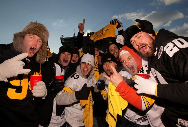 PITTSBURGH, PA - JANUARY 23:  Fans of the Pittsburgh Steelers pose for a photo as they tailgate outside the stadium prior to the 2011 AFC Championship game against the New York Jets at Heinz Field on January 23, 2011 in Pittsburgh, Pennsylvania.  (Photo b