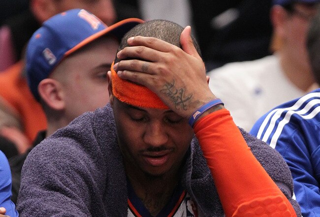 NEW YORK, NY - APRIL 22:  Carmelo Anthony #7 of the New York Knicks sits on the bench dejected late in the second half against the Boston Celtics in Game Three of the Eastern Conference Quarterfinals in the 2011 NBA Playoffs on April 22, 2011 at Madison S