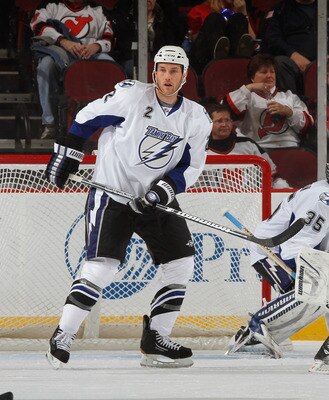 NEWARK, NJ - MARCH 02:  Eric Brewer #2 of the Tampa Bay Lightning helps defend the net during an NHL hockey game against the New Jersey Devils at the Prudential Center on March 2, 2011 in Newark, New Jersey.  (Photo by Paul Bereswill/Getty Images)