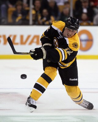 BOSTON, MA - APRIL 14:  Tomas Kaberle #12 of the Boston Bruins passes the puck in Game One of the Eastern Conference Quarterfinals during the 2011 NHL Stanley Cup Playoffs at TD Garden on April 14, 2011 in Boston, Massachusetts. The Montreal Canadiens def