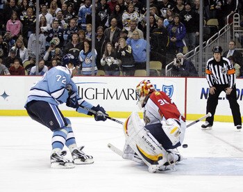 PITTSBURGH, PA - MARCH 27: Alexei Kovalev #72 of the Pittsburgh Penguins scores past Scott Clemmensen #30 of the Florida Panthers during the shootout at Consol Energy Center on March 27, 2011 in Pittsburgh, Pennsylvania. The Penguins defeated the Panthers