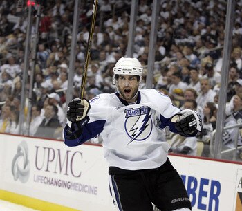 PITTSBURGH, PA - APRIL 23:  Simon Gagne #12 of the Tampa Bay Lightning celebrates his second period goal against the Pittsburgh Penguins in Game Five of the Eastern Conference Quarterfinals during the 2011 NHL Stanley Cup Playoffs at Consol Energy Center