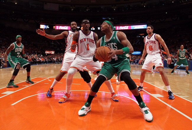 NEW YORK, NY - APRIL 24:  Paul Pierce #34 of the Boston Celtics looks to go up for a shot against Amar'e Stoudemire #1, Ronny Turiaf #14 and Landry Fields #6 of the New York Knicks in Game Four of the Eastern Conference Quarterfinals during the 2011 NBA P