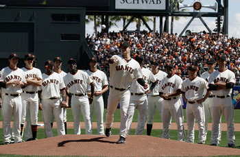 SAN FRANCISCO, CA - APRIL 08:  Matt Cain #18 of the San Francisco Giants throws out the first pitch before the start of the opening day game against the St. Louis Cardinals at AT&T Park on April 8, 2011 in San Francisco, California.  (Photo by Marcio Jose