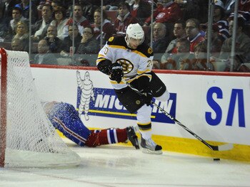 MONTREAL, CANADA - APRIL 18:  Daniel Paille #20 of the Boston Bruins jumps past a sprawling Montreal Canadiens players in Game Three of the Eastern Conference Quarterfinals during the 2011 NHL Stanley Cup Playoffs at the Bell Centre on April 18, 2011 in M